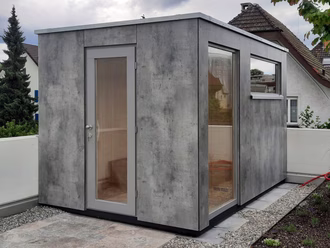 aussensauna-mit-hpl-vollkern-fassade-in-betonoptik