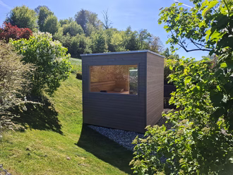 gartensauna-in-massivholz-mit-vorvergrauter-holzfassade-3